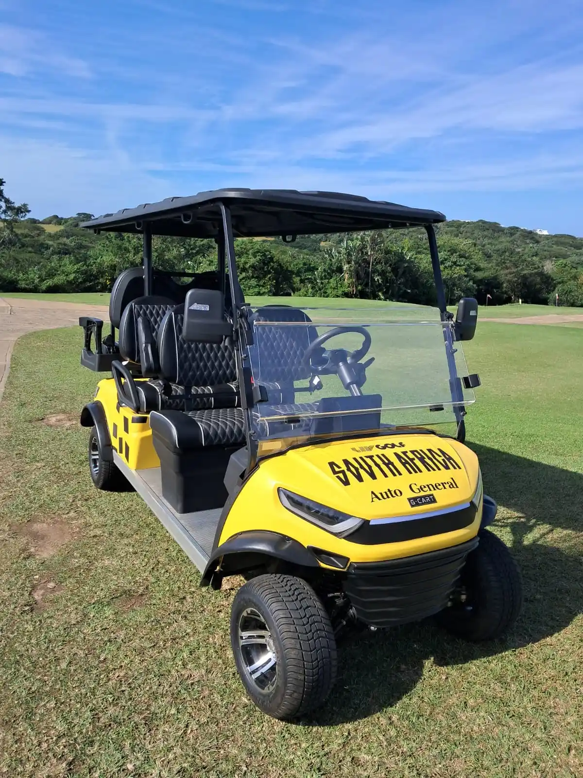 Yellow G-CART in LIV Golf South Africa and Auto General livery on a golf course